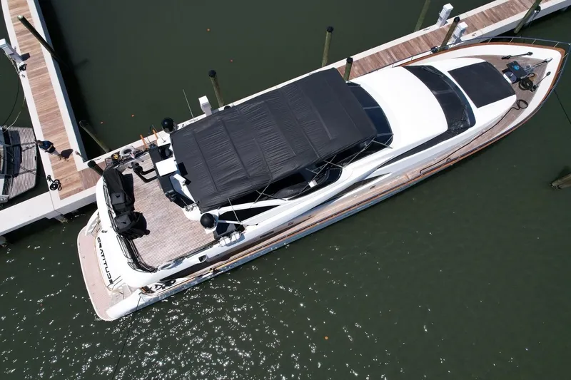 Slide: The Image of Overhead view of a 1999 Azimut 85 Ultimate yacht docked at a marina. - 109