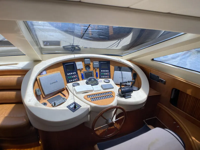 Slide: The Image of Cockpit of 1999 Azimut 85 Ultimate yacht with navigation instruments and steering wheel. - 28