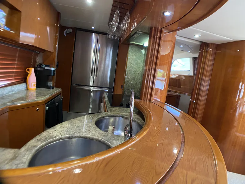Slide: The Image of Luxurious kitchen interior of 1999 Azimut 85 Ultimate yacht with modern appliances and wood finish. - 7