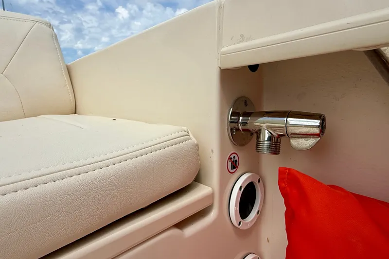 Slide: The Image of 2026 Grady-White Fisherman 180 boat interior with seating and chrome fixture detail. - 12