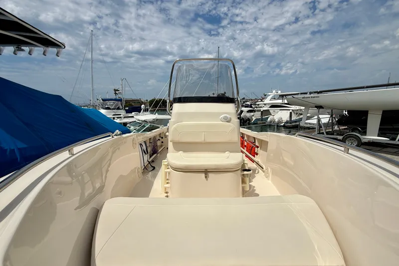 Slide: The Image of 2026 Grady-White Fisherman 180 boat docked at marina under cloudy sky. - 4