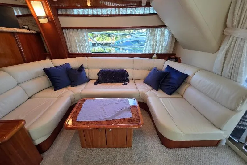 Slide: The Image of Luxurious 2008 Neptunus Flybridge MY yacht interior with cream leather seating and wooden table. - 50