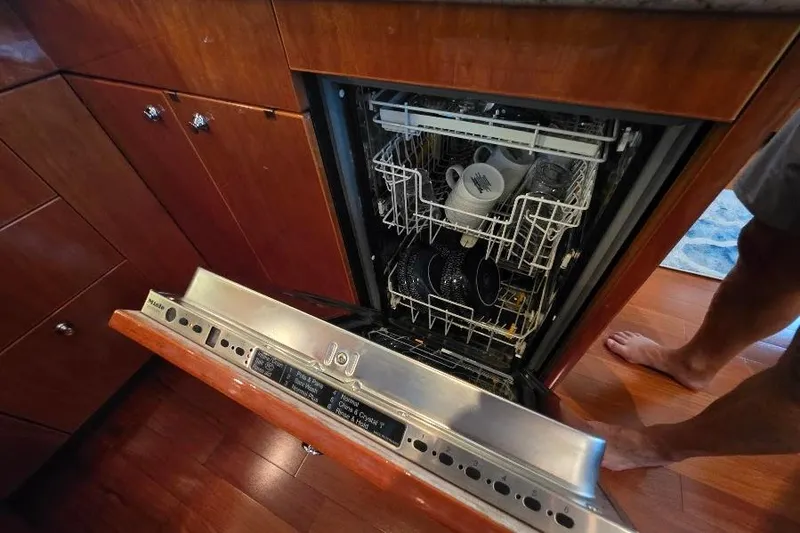 Slide: The Image of Open dishwasher in Neptunus Flybridge MY 2008 yacht kitchen, loaded with dishes. - 58