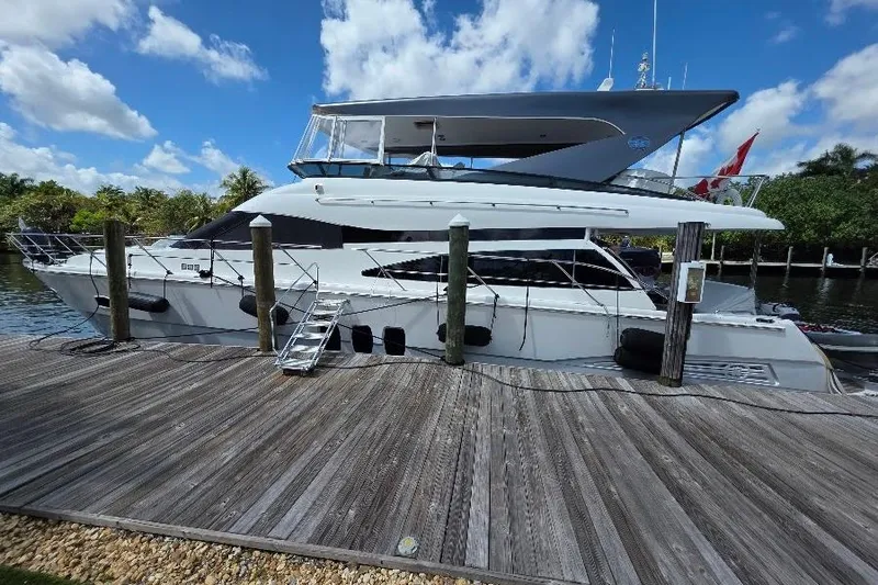 Slide: The Image of 2008 Neptunus Flybridge MY yacht docked under a clear blue sky. - 4
