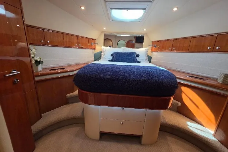 Slide: The Image of Luxurious 2008 Neptunus Flybridge MY yacht bedroom with elegant wood finishes and cozy bedding. - 113