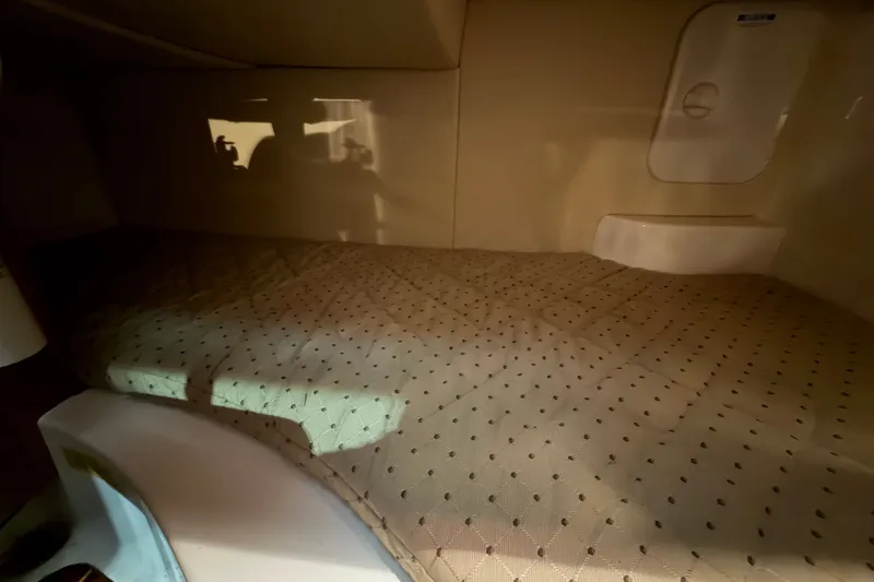 Slide: The Image of Interior cabin of 2008 Pursuit OS 285 Offshore boat with cozy bedding. - 20