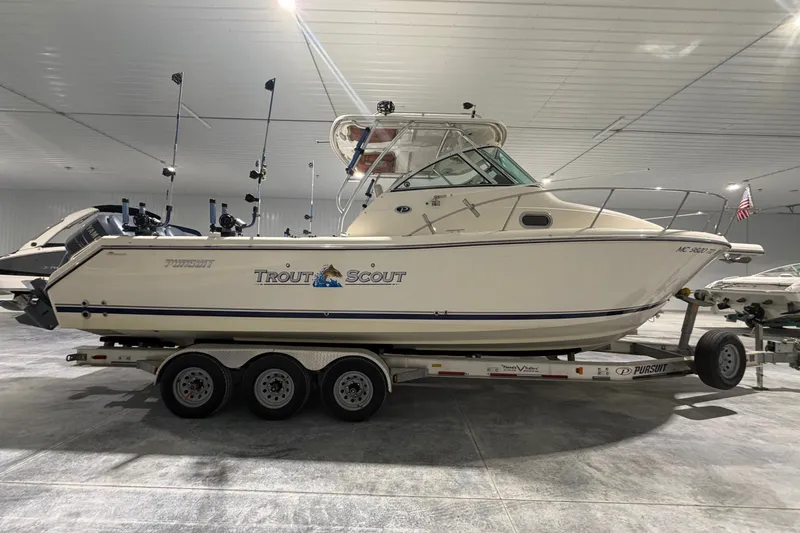 The Image of 2008 Pursuit OS 285 Offshore boat on trailer in indoor storage facility. - 4