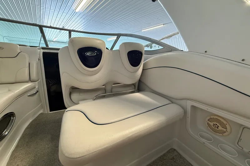 Slide: The Image of Interior of a 2005 Crownline 270 CR boat with white seating and modern design. - 17