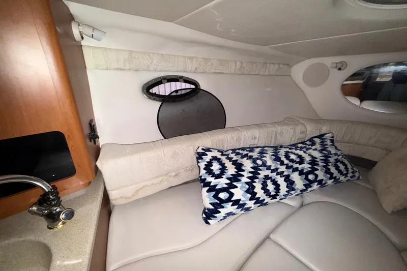 Slide: The Image of Interior of 2005 Crownline 270 CR boat with cozy seating and decorative pillow. - 34