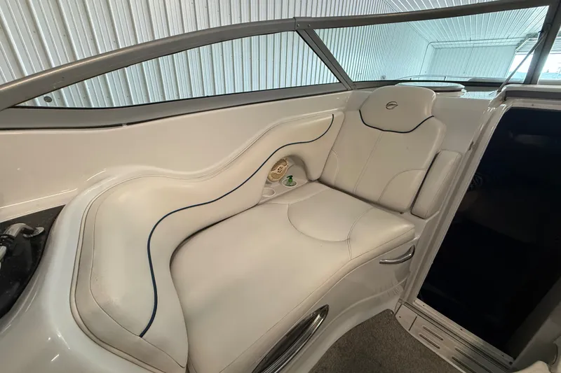 Slide: The Image of 2005 Crownline 270 CR boat interior with white seating and sleek design. - 22