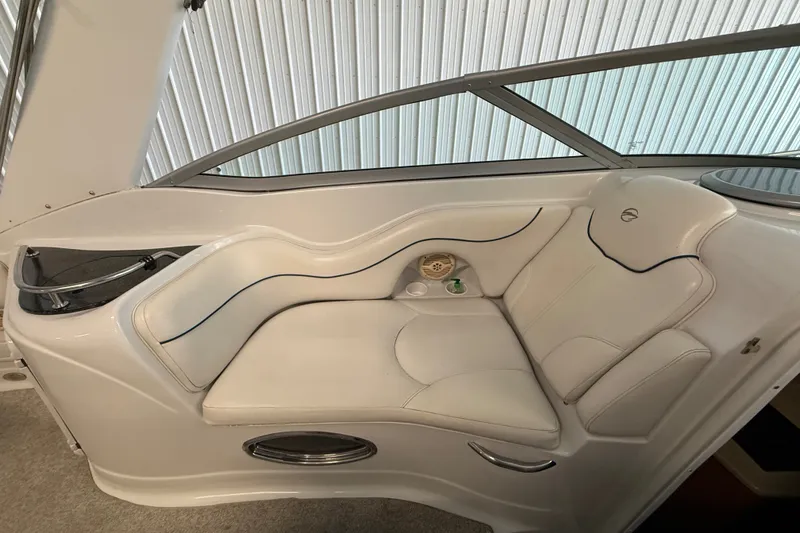 Slide: The Image of 2005 Crownline 270 CR boat interior with white seating and sleek design. - 23