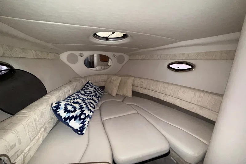 Slide: The Image of Luxurious interior cabin of 2005 Crownline 270 CR boat with plush seating and pillows. - 32