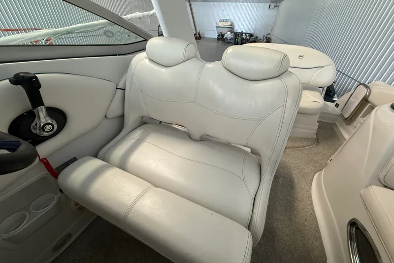 Slide: The Image of Interior of a 2005 Crownline 270 CR boat with white leather seating. - 28