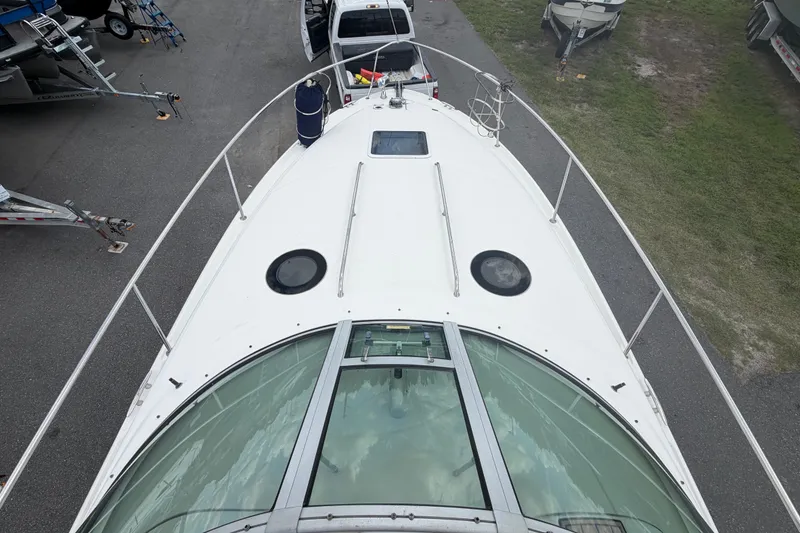 Slide: The Image of Top view of a 2006 Sea Ray 300 Sundancer boat docked on land. - 16