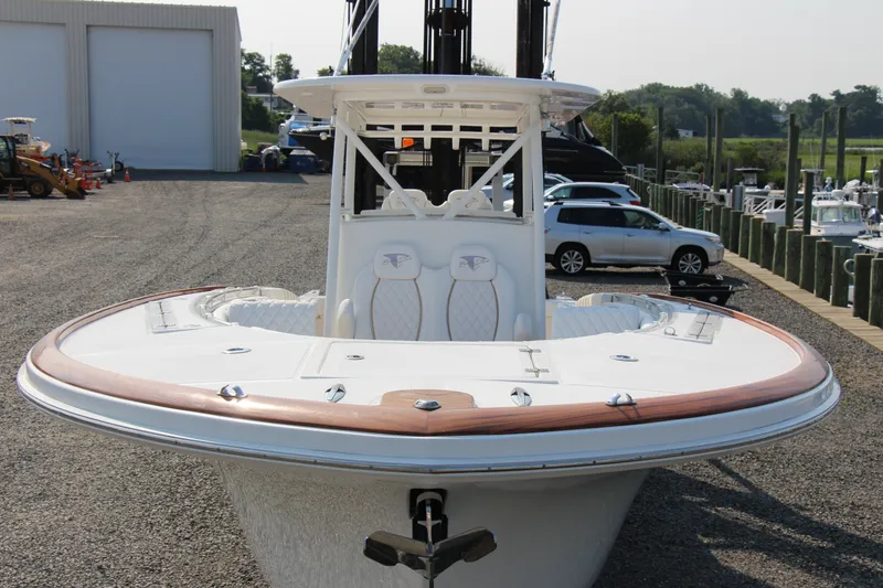Slide: The Image of 2019 Buddy Davis 34 Center Console boat docked at a marina. - 19