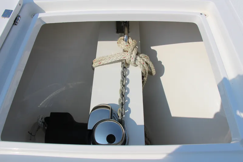 Slide: The Image of Anchor locker of 2019 Buddy Davis 34 Center Console with rope and chain. - 28