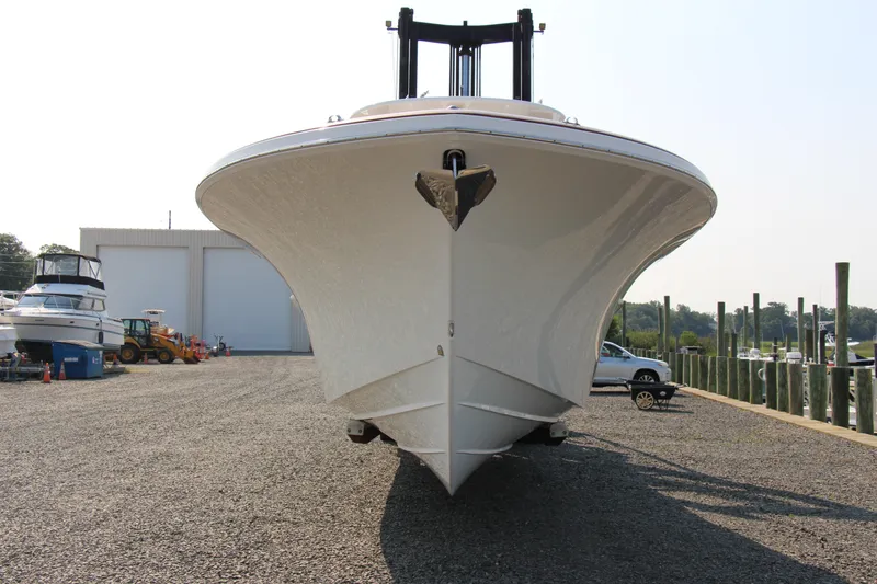 Slide: The Image of 2019 Buddy Davis 34 Center Console boat on gravel near marina. - 18