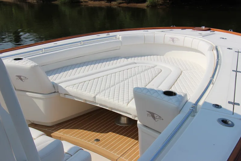 Slide: The Image of Luxurious seating on 2019 Buddy Davis 34 Center Console boat, featuring elegant white upholstery. - 24