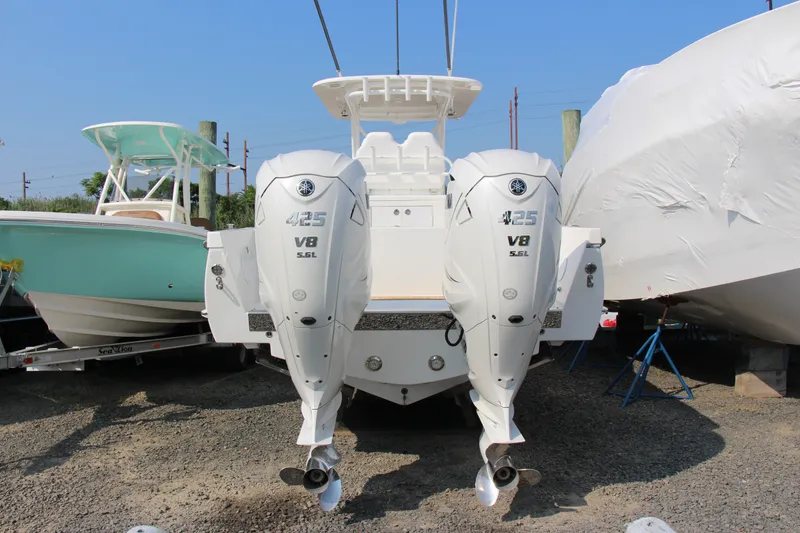 Slide: The Image of 2019 Buddy Davis 34 Center Console with twin Yamaha 425 V8 engines, docked outdoors. - 23