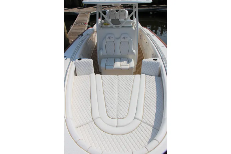 Slide: The Image of 2019 Buddy Davis 34 Center Console boat with luxurious white seating and spacious deck. - 29