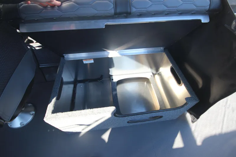 Slide: The Image of 2025 Weldcraft 210 Revolution Soft Top interior storage compartment detail. - 15