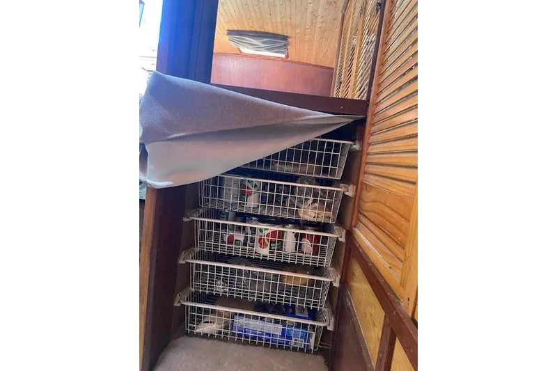 Slide: The Image of Storage baskets filled with supplies inside a 1979 SUNYONG PS Trawler boat. - 47