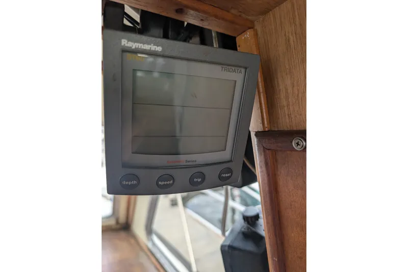 Slide: The Image of Raymarine Tridata display on 1979 SUNYONG PS Trawler, showing depth, speed, and trip functions. - 34