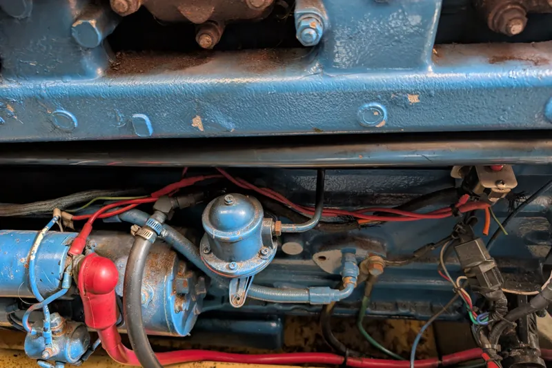 Slide: The Image of Close-up of a 1979 SUNYONG PS Trawler engine with visible wiring and components. - 53