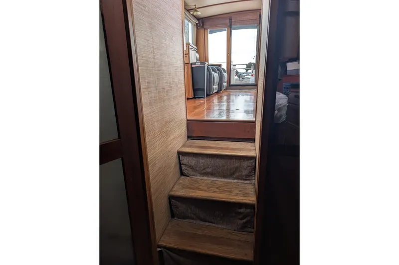 Slide: The Image of Interior stairs of 1979 SUNYONG PS Trawler leading to a sunlit cabin area. - 48