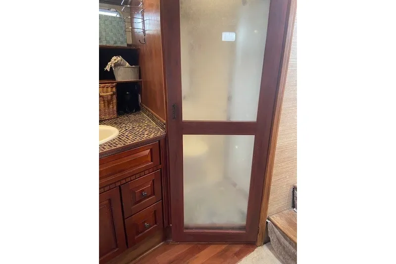 Slide: The Image of Wooden bathroom interior with frosted glass door on a 1979 SUNYONG PS Trawler. - 44