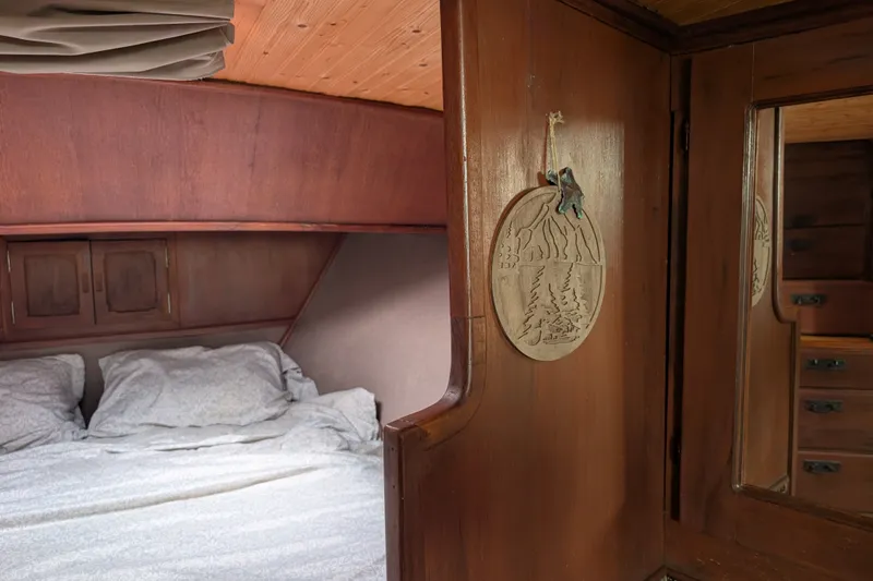 Slide: The Image of Cozy cabin interior of 1979 SUNYONG PS Trawler with wooden decor and bedding. - 43
