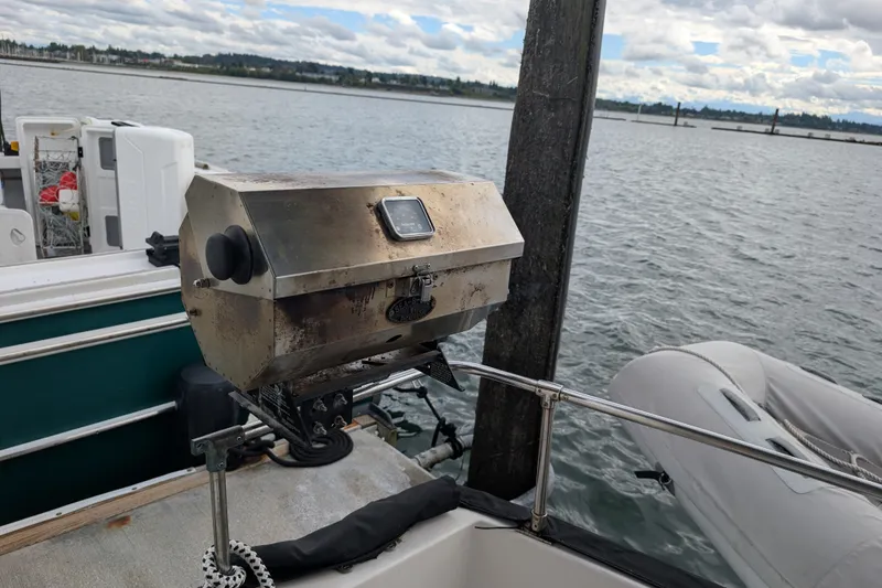 Slide: The Image of Outdoor grill on a 1979 SUNYONG PS Trawler boat docked by the water. - 57