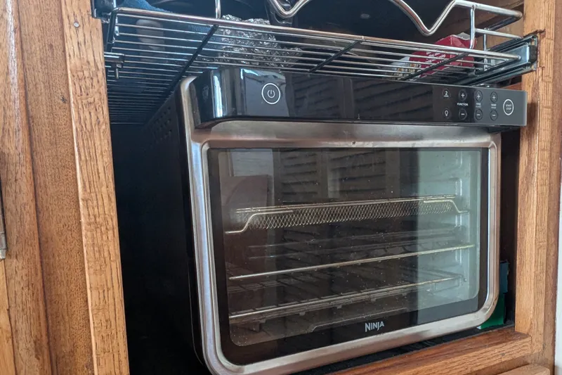Slide: The Image of Compact Ninja oven in wooden cabinet on SUNYONG PS Trawler, 1979 model. - 26