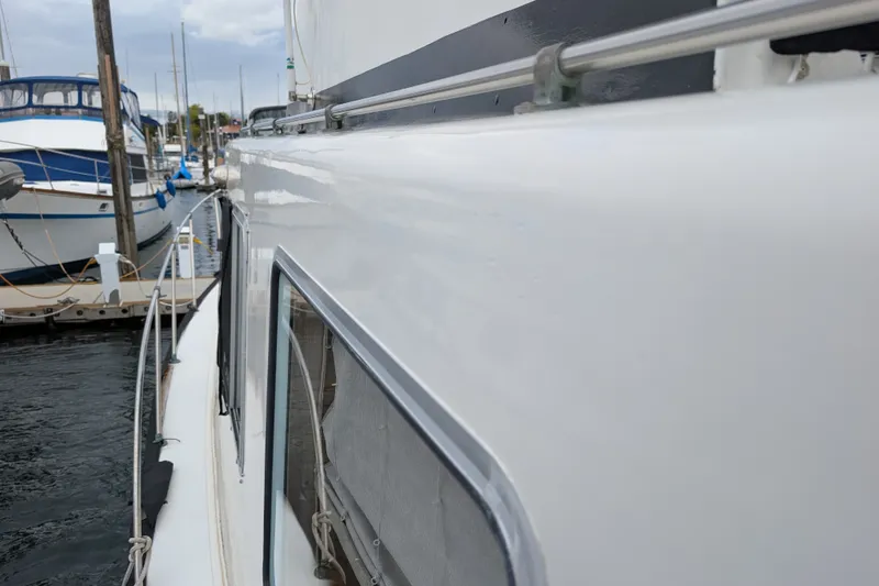Slide: The Image of Side view of a 1979 SUNYONG PS Trawler docked at a marina. - 10