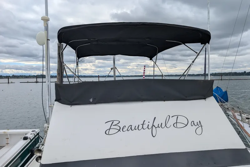 Slide: The Image of SUNYONG PS Trawler 1979 with "Beautiful Day" text, docked under cloudy skies. - 1