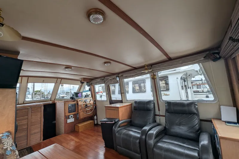 Slide: The Image of Interior of 1979 SUNYONG PS Trawler with leather chairs and wooden helm. - 17