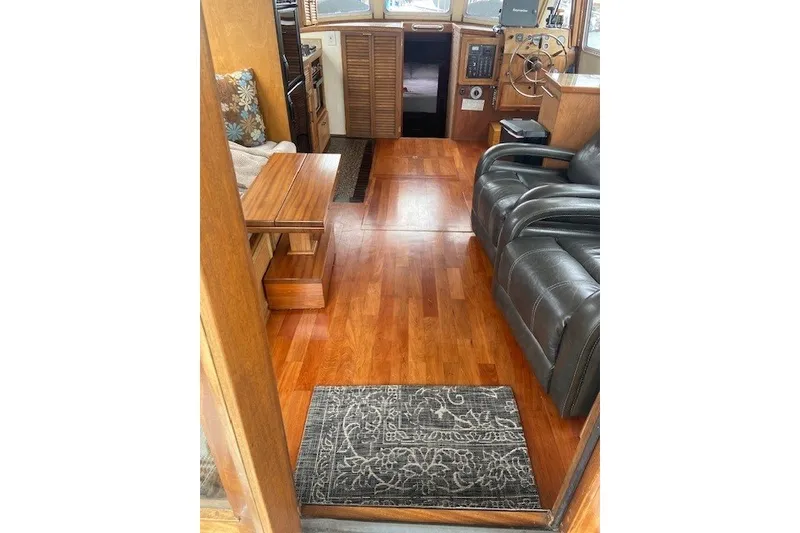 Slide: The Image of Interior of 1979 SUNYONG PS Trawler with wooden flooring and leather seating. - 18