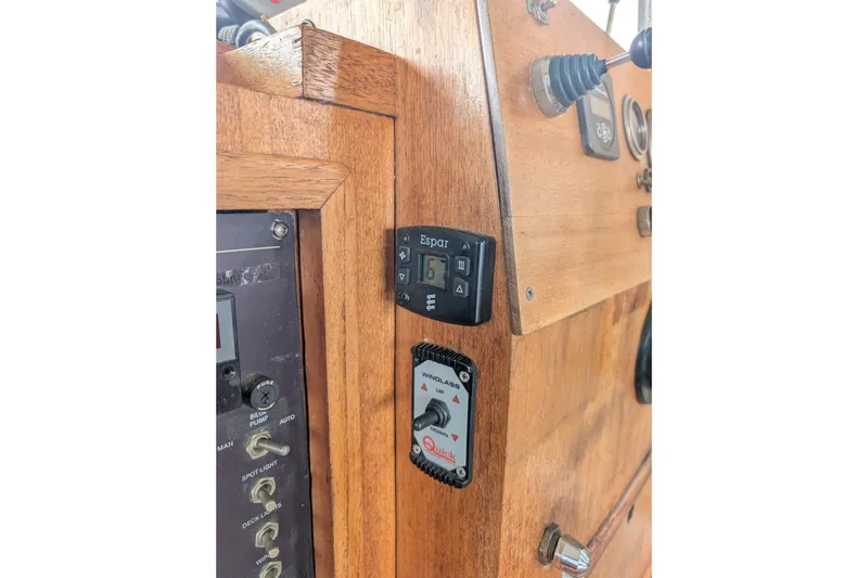 Slide: The Image of Wooden control panel of a 1979 SUNYONG PS Trawler with various switches and gauges. - 39