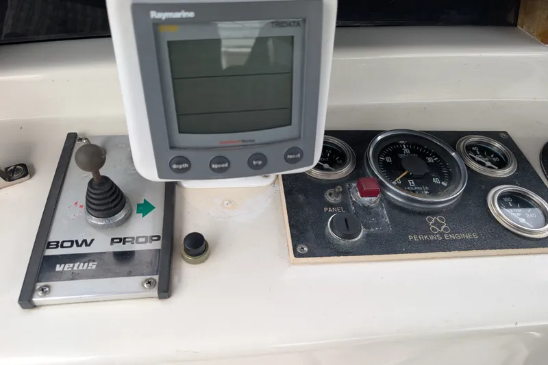 Slide: The Image of Control panel of a 1979 SUNYONG PS Trawler with navigation and engine gauges. - 6