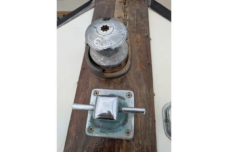 Slide: The Image of Vintage SUNYONG PS Trawler 1979 winch and lever on wooden deck. - 12