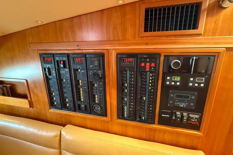 Slide: The Image of Electrical control panel on 2017 MJM 50z yacht, featuring various switches and displays. - 62