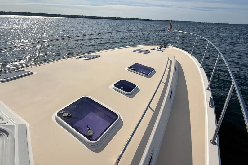Slide: The Image of 2017 MJM 50z yacht deck with hatches, cruising on open water. - 49