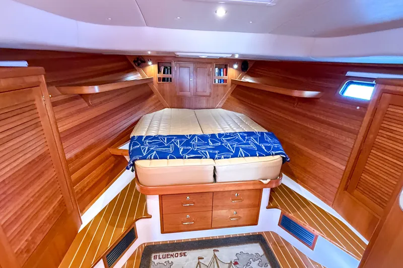 Slide: The Image of Luxurious 2017 MJM 50z yacht cabin with wooden interior and cozy bed. - 40