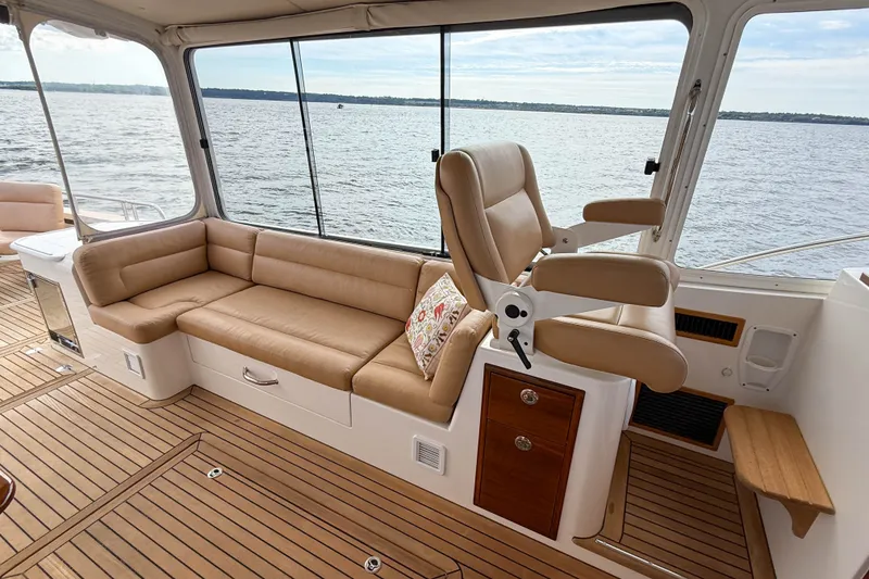 Slide: The Image of Luxurious interior of 2017 MJM 50z yacht with leather seating and ocean view. - 16