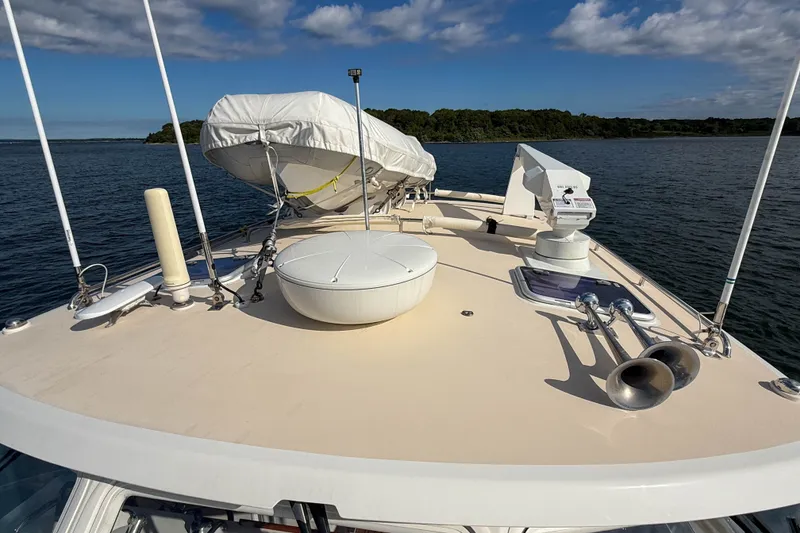 Slide: The Image of 2017 MJM 50z yacht deck with equipment, lifeboat, and scenic water view. - 54