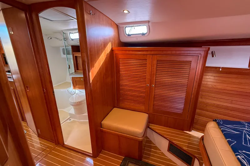 Slide: The Image of Luxurious 2017 MJM 50z yacht interior with wooden cabinetry and bathroom. - 42