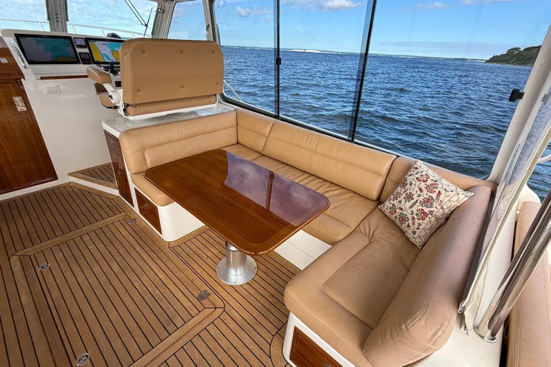 Slide: The Image of Luxurious 2017 MJM 50z yacht interior with leather seating and ocean view. - 19