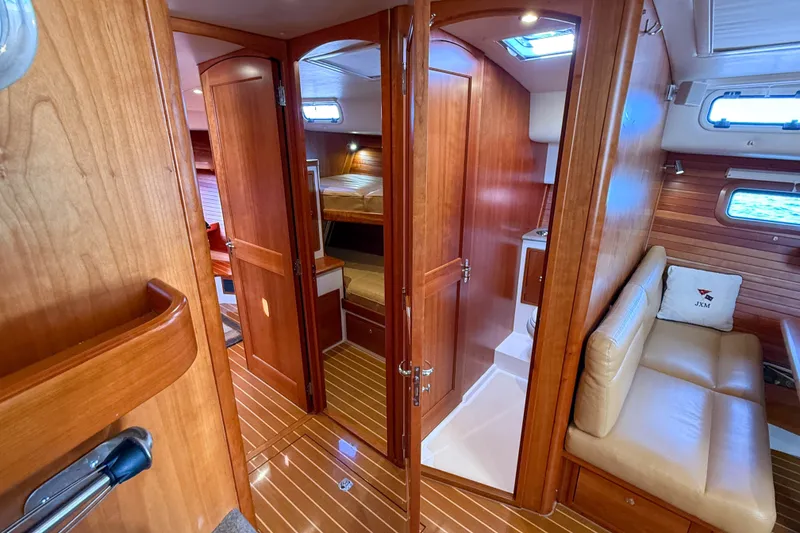 Slide: The Image of Luxurious 2017 MJM 50z yacht interior with wood finish and cozy seating area. - 34