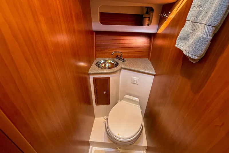 Slide: The Image of Luxurious 2017 MJM 50z yacht bathroom with wood paneling and modern fixtures. - 39