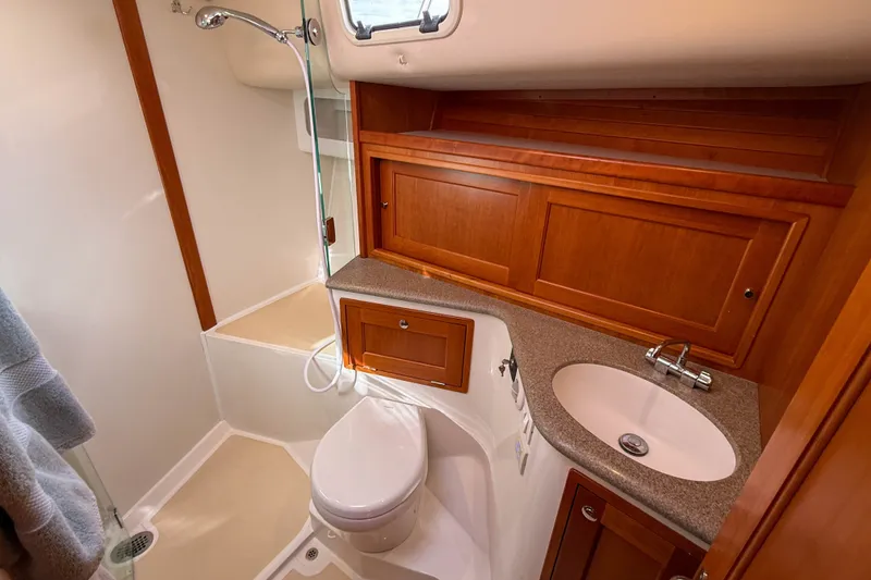 Slide: The Image of Luxurious 2017 MJM 50z yacht bathroom with wooden cabinetry and modern fixtures. - 44